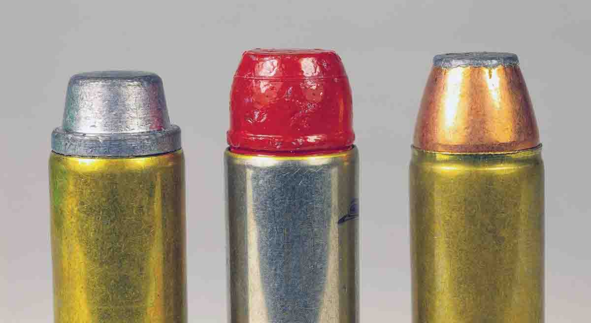These .44 magnum cartridges show different amounts of crimp to their bullets. The left and middle cartridges have a standard roll crimp. The cartridge at right has a ”neck down” crimp that nearly fills the crimping cannelure.